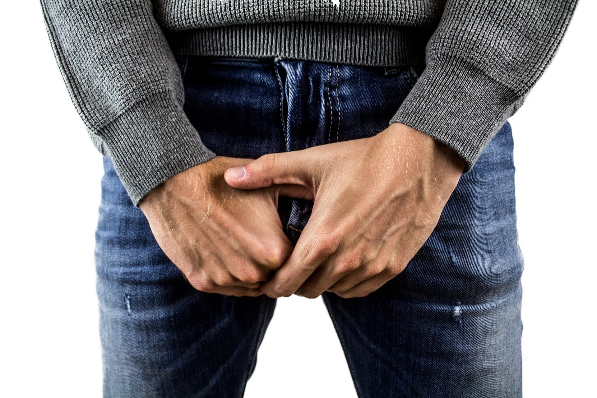 Testicular Cancer - man covering his groin with his hands